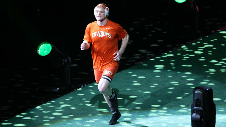 Mar 23, 2024; Kansas City, MO, USA;  At 184 pounds Oklahoma State Cowboys Dustin Plott enters the arena before his match with Northern Iowa Panthers Parker Keckeisen.  Mandatory Credit: Reese Strickland-Imagn Images