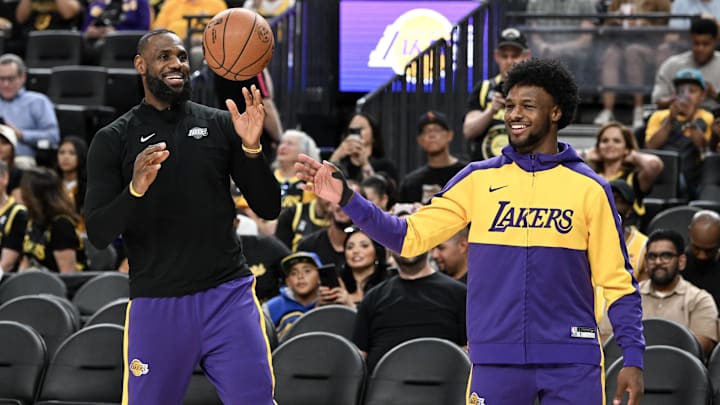 Oct 15, 2024; Las Vegas, Nevada, USA; Los Angeles Lakers forward LeBron James (23) warms up with guard Bronny James (9) before the preseason game against the Golden State Warriors at T-Mobile Arena. Mandatory Credit: Candice Ward-Imagn Images