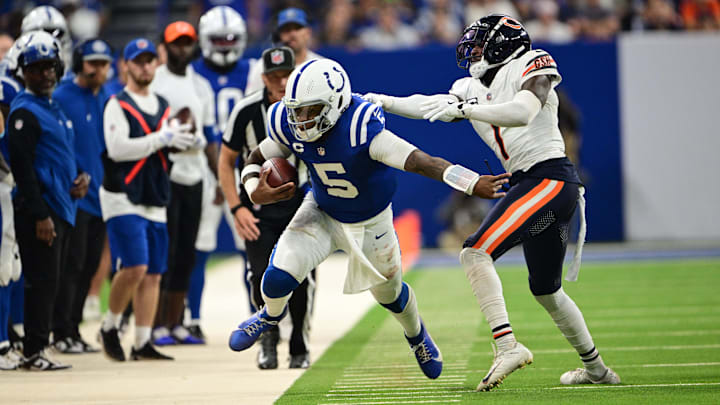 Jaylon Johnson reaches out on tackle attempt in Week 3 at Indianapolis. Johnson is questionable to face Detroit Sunday.