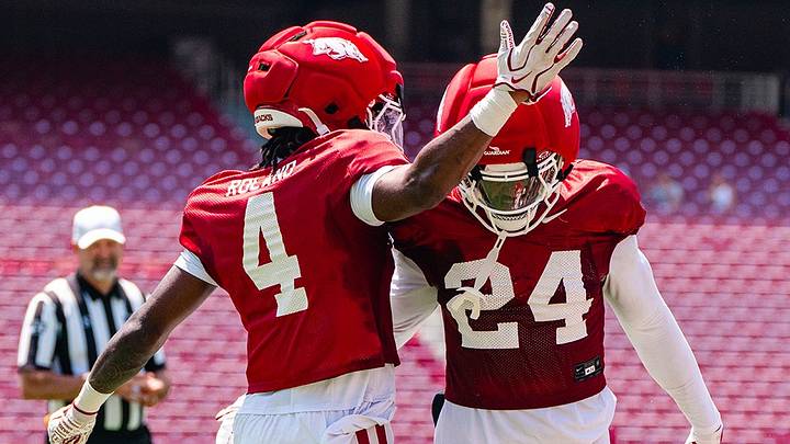 Arkansas Razorback defensive backs La'Khi Roland and Miguel Mitchell celebrate following a play in scrimmage one of fall camp. Arkansas Razorback defensive backs La'Khi Roland and Miguel Mitchell celebrate following a play in scrimmage one of fall camp.