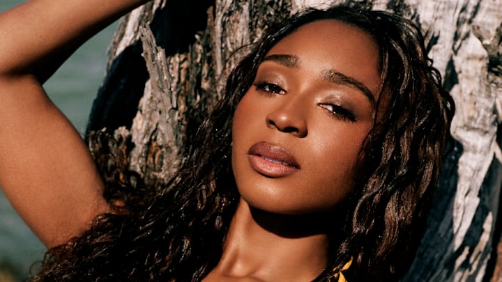 Normani was photographed by Katherine Goguen on Captiva Island, Fla. Swimsuit by OYE Swimwear.