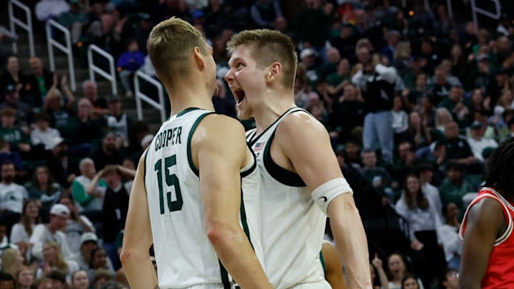 Michigan State forward Jaxon Kohler, right, screams in celebration to center Carson Cooper, left, after Cooper converted an alley-oop against the Detroit Mercy Titans at the Breslin Center on Friday, Nov. 21, 2025.