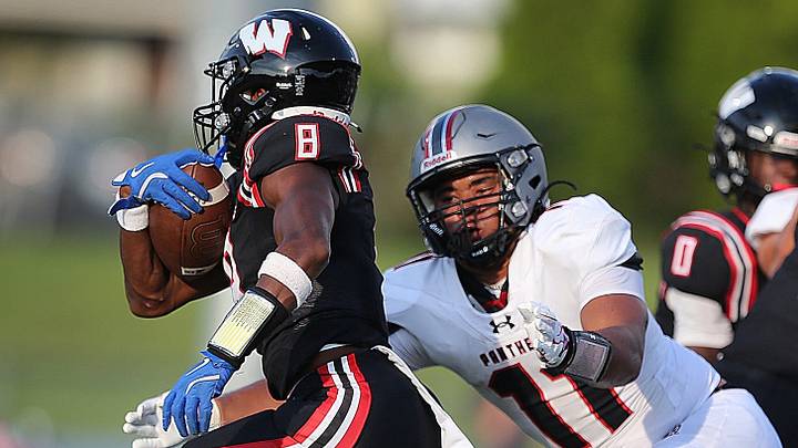 Woodbridge's Kadir Glover runs as Bridgewater-Raritan's Jahmier Black chases him for the tackle in the football game on Aug. 28, 2026. Woodbridge's Kadir Glover runs as Bridgewater-Raritan's Jahmier Black chases him for the tackle in the football game on Aug. 28, 2026.