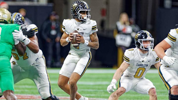 Carrollton freshman quarterback CJ Cypher drops back to pass in the 2025 GHSA Class 6A Championship loss to Buford. Carrollton freshman quarterback CJ Cypher drops back to pass in the 2025 GHSA Class 6A Championship loss to Buford.
