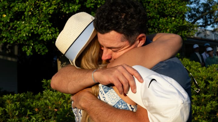 Rory McIlroy embraces Kate Phillips after win at Masters.