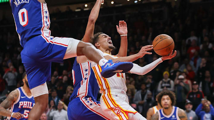 Jan 10, 2024; Atlanta, Georgia, USA; Atlanta Hawks guard Trae Young (11) is fouled by Philadelphia