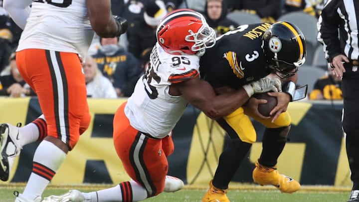 Dec 8, 2024; Pittsburgh, Pennsylvania, USA;  Cleveland Browns defensive end Myles Garrett (95) sacks Pittsburgh Steelers quarterback Russell Wilson (3) during the fourth quarter at Acrisure Stadium.