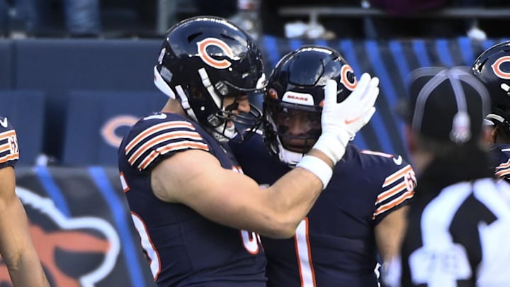Nov 13, 2022; Chicago, Illinois, USA;  Chicago Bears quarterback Justin Fields (1) celebrates with Chicago Bears tight end Cole Kmet (85, left, after he runs for a touchdown against the Detroit Lions during the second half at Soldier Field. Mandatory Credit: Matt Marton-Imagn Images