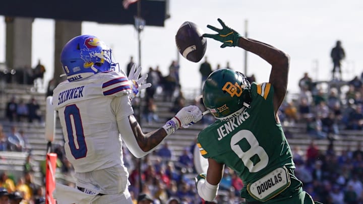 Nov 30, 2024; Waco, Texas, USA;  Baylor Bears cornerback Caden Jenkins (8) breaks up a pass intended for Kansas Jayhawks wide receiver Quentin Skinner (0) during the second half at McLane Stadium. Mandatory Credit: Chris Jones-Imagn Images