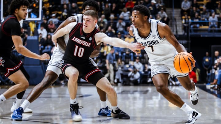Cal guard Dai Dai Ames drives on Louisville defender Isaac McKneely