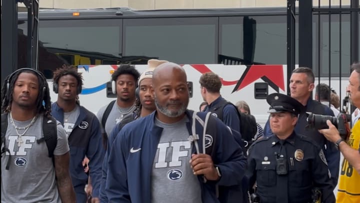 Penn State interim head coach Terry Smith walks into Kinnick Stadium with the Nittany Lions.