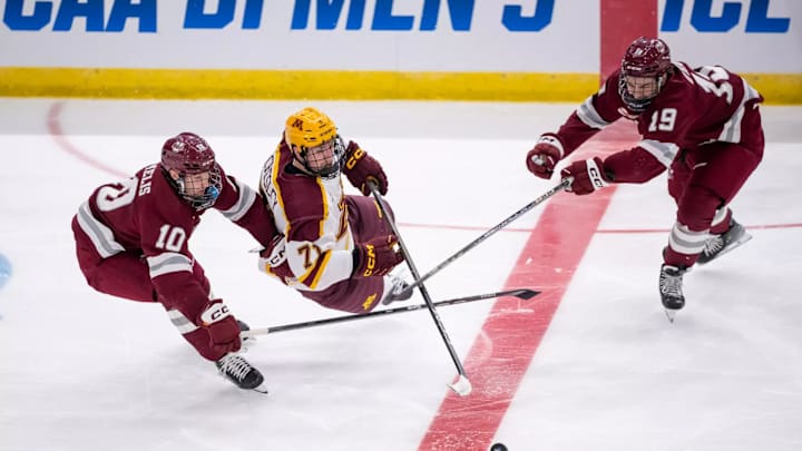 Gophers defenseman Ryan Chesley falls to the ice after an apparent trip that went uncalled during overtime. 
