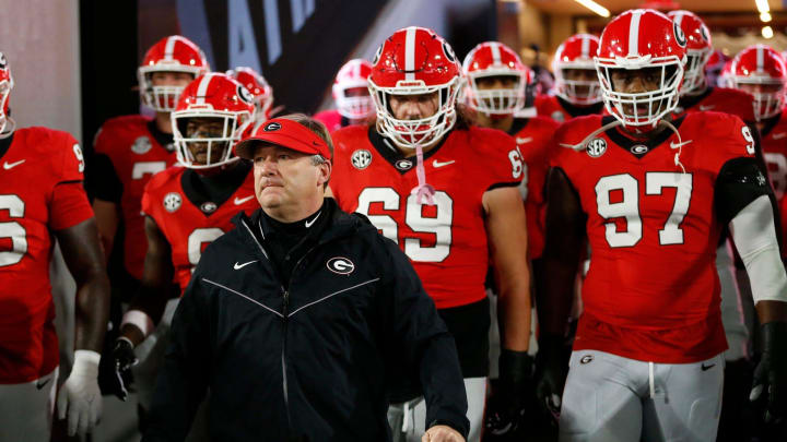 Georgia coach Kirby Smart lead the team onto the field to warm up before the start of a NCAA college football game against Ole Miss in Athens, Ga., on Saturday, Nov. 11, 2023.