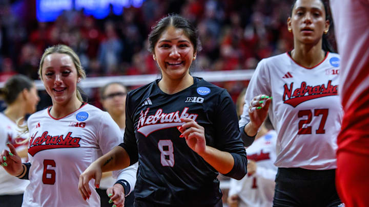 Lexi Rodriguez (8) and Laney Choboy (6) smile as they run off the court after advancing to the Elite Eight. 