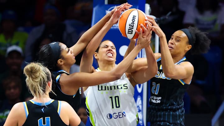 May 15, 2024; Arlington, Texas, USA;  Chicago Sky forward Angel Reese (5) and Chicago Sky forward Brianna Turner (21) and Dallas Wings center Stephanie Soares (10) go for the ball during the first half at College Park Center. Mandatory Credit: Kevin Jairaj-Imagn Images