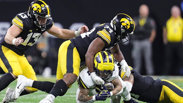 Michigan running back Blake Corum runs against Iowa defensive back Xavier Nwankpa (1) during the second half of U-M's 26-0 win over Iowa in the Big Ten championship game in Indianapolis on Saturday, Dec. 2, 2023.