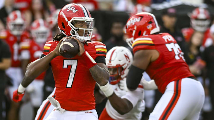 Oct 11, 2025; College Park, Maryland, USA; Rahtrel Perry (76) blocks for Maryland Terrapins quarterback Malik Washington (7) during the game against the Nebraska Cornhuskers at SECU Stadium.
