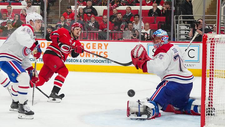 Mar 29, 2026; Raleigh, North Carolina, USA;  Carolina Hurricanes center Sebastian Aho (20) misses on his shot attempt against Montreal Canadiens goaltender Jakub Dobes (75) during the third period at Lenovo Center. Mandatory Credit: James Guillory-Imagn Images