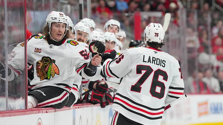 Jan 22, 2026; Raleigh, North Carolina, USA;  Chicago Blackhawks left wing Nick Lardis (76) celebrates his goal with left wing Tyler Bertuzzi (59) against the Carolina Hurricanes during the second period at Lenovo Center. Mandatory Credit: James Guillory-Imagn Images