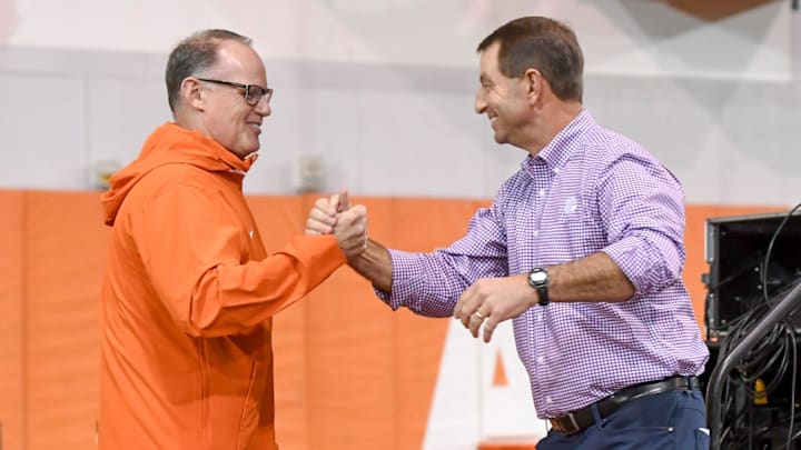 Clemson defensive coordinator Tom Allen greets head coach Dabo Swinney on the way to speaking during the Clemson Club football National Signing Day wrap up presented by Clemson Seneca Chick-Fil-A at the Poe Indoor Practice Facility at Clemson University in Clemson, S.C. Feb 5, 2025.