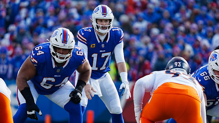Buffalo Bills quarterback Josh Allen eyes how the Denver Broncos are lined up as he calls the play during the first half of the Buffalo Bills wild card game against the Denver Broncos at Highmark Stadium in Orchard Park on Jan. 12, 2025. Buffalo Bills quarterback Josh Allen eyes how the Denver Broncos are lined up as he calls the play during the first half of the Buffalo Bills wild card game against the Denver Broncos at Highmark Stadium in Orchard Park on Jan. 12, 2025.