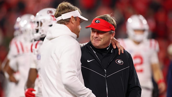Nov 11, 2023; Athens, Georgia, USA; Mississippi Rebels head coach Lane Kiffin talks to Georgia Bulldogs head coach Kirby Smart before a game at Sanford Stadium. Mandatory Credit: Brett Davis-Imagn Images