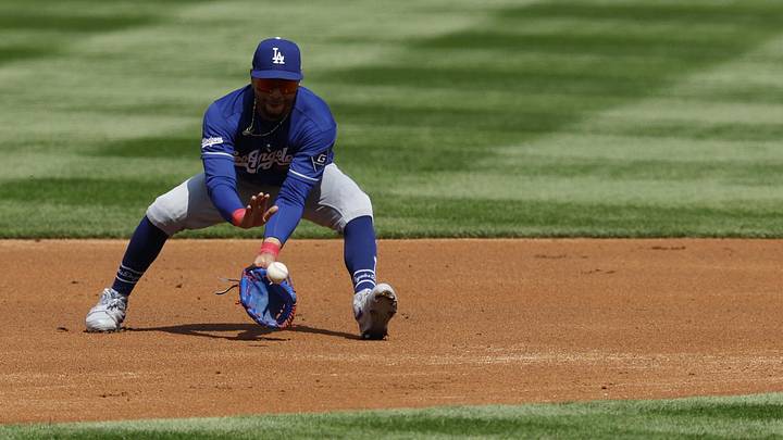 Apr 3, 2026; Washington, District of Columbia, USA; Los Angeles Dodgers shortstop Mookie Betts (50) fields a ground ball by Washington Nationals second baseman Luis García Jr. (not pictured) during the first inning at Nationals Park. Mandatory Credit: Geoff Burke-Imagn Images