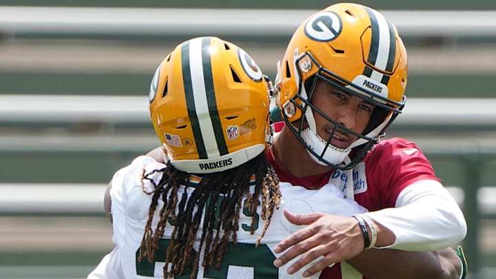 May 31, 2022; Green Bay, WI, USA; Green Bay Packers quarterback Jordan Love (10) and teammate Aaron Jones (33) hug during organized team activities (OTA) Tuesday, May 31, 2022 in Green Bay, Wis.  Mandatory Credit: Mark Hoffman-USA TODAY Sports