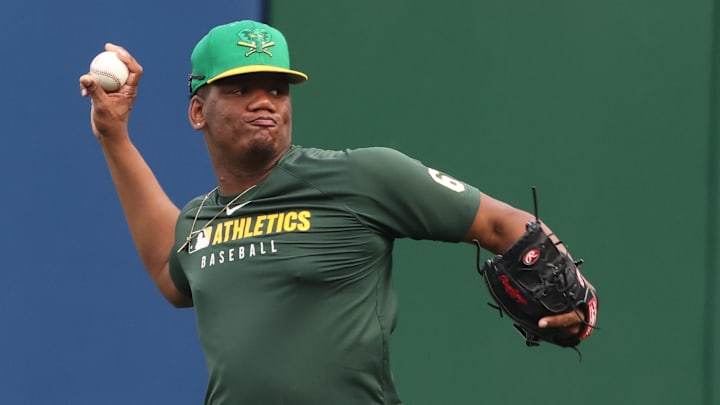 Sep 20, 2025; Pittsburgh, Pennsylvania, USA; Athletics pitcher Elvis Alvarado (61) throws in the outfield before the game against the Pittsburgh Pirates at PNC Park. Mandatory Credit: Charles LeClaire-Imagn Images Sep 20, 2025; Pittsburgh, Pennsylvania, USA; Athletics pitcher Elvis Alvarado (61) throws in the outfield before the game against the Pittsburgh Pirates at PNC Park. Mandatory Credit: Charles LeClaire-Imagn Images