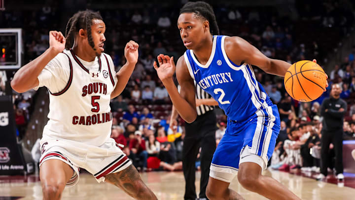 Feb 24, 2026; Columbia, South Carolina, USA; Kentucky Wildcats guard Jasper Johnson (2) drives around South Carolina Gamecocks guard Meechie Johnson (5) during the second half at Colonial Life Arena. Mandatory Credit: Jeff Blake-Imagn Images