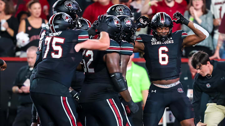 Nov 2, 2024; Columbia, South Carolina, USA; South Carolina Gamecocks tight end Joshua Simon (6) celebrates a touchdown reception against the Texas A&M Aggies in the first quarter at Williams-Brice Stadium. Mandatory Credit: Jeff Blake-Imagn Images