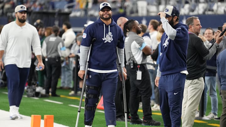 Dallas Cowboys quarterback Dak Prescott stands on crutches before the game against the New York Giants.