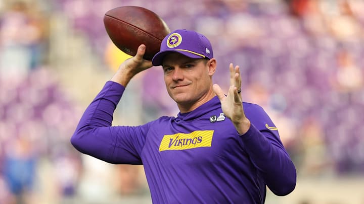 Oct 20, 2024; Minneapolis, Minnesota, USA; Minnesota Vikings head coach Kevin O'Connell throws a ball before the game against the Detroit Lions at U.S. Bank Stadium. 