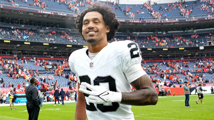 Sep 10, 2023; Denver, Colorado, USA; Las Vegas Raiders safety Isaiah Pola-Mao (20) reacts following the win over the Denver Broncos at Empower Field at Mile High. Mandatory Credit: Ron Chenoy-USA TODAY Sports