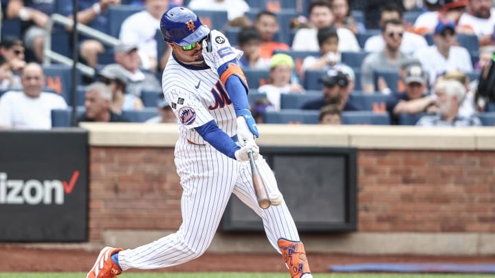Jun 30, 2024; New York City, New York, USA;  New York Mets third baseman Mark Vientos (27) hits a two RBI double in the sixth inning against the Houston Astros at Citi Field.