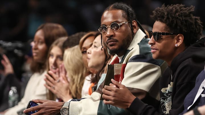 Oct 1, 2024; Brooklyn, New York, USA;  Former NBA forward Carmelo Anthony and his son Kyian Anthony during game two of the 2024 WNBA Semi-finals at Barclays Center. Mandatory Credit: Wendell Cruz-Imagn Images