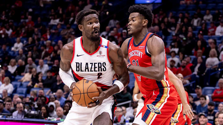 Nov 4, 2024; New Orleans, Louisiana, USA;  Portland Trail Blazers center Deandre Ayton (2) dribbles against New Orleans Pelicans center Yves Missi (21) during the first half at Smoothie King Center. Mandatory Credit: Stephen Lew-Imagn Images