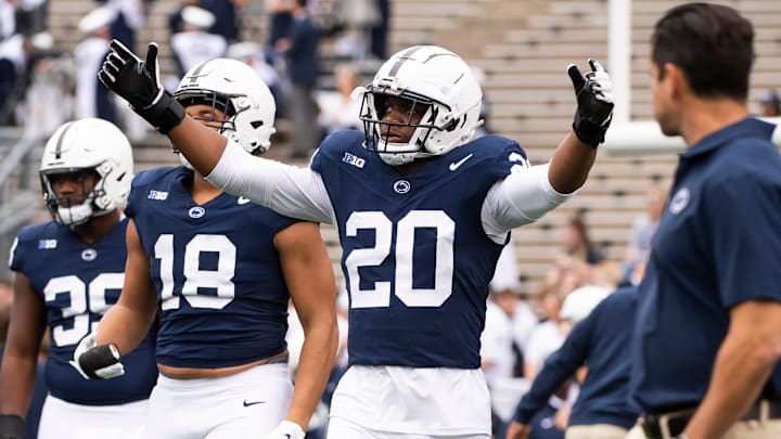 Penn State defensive end Adisa Isaac (20) enters the field with the rest of the defensive unit for team warmups before an NCAA football game against Indiana Saturday, Oct. 28, 2023, in State College, Pa. The Nittany Lions won, 33-24.