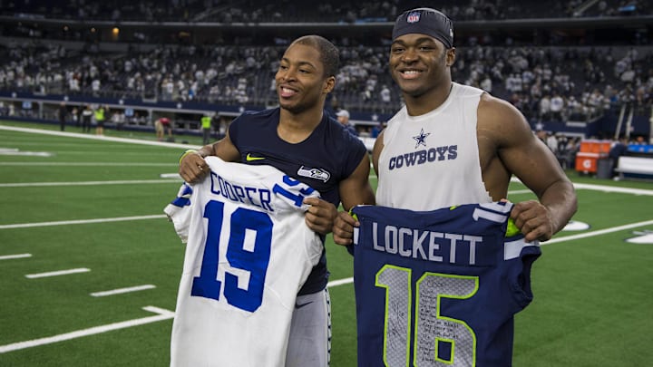 Jan 5, 2019; Arlington, TX, USA; Dallas Cowboys wide receiver Amari Cooper (right) exchanges jerseys with Seattle Seahawks wide receiver Tyler Lockett (left) after a NFC Wild Card playoff football game at AT&T Stadium. Jan 5, 2019; Arlington, TX, USA; Dallas Cowboys wide receiver Amari Cooper (right) exchanges jerseys with Seattle Seahawks wide receiver Tyler Lockett (left) after a NFC Wild Card playoff football game at AT&T Stadium.