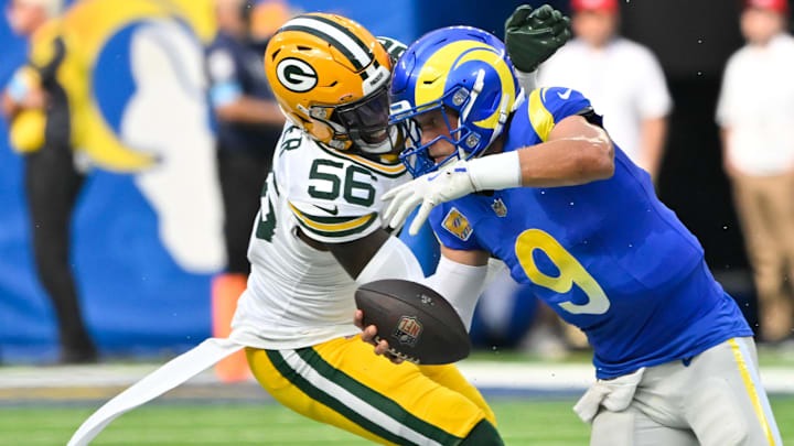 Green Bay Packers linebacker Edgerrin Cooper (56) sacks Los Angeles Rams quarterback Matthew Stafford.