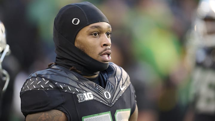Nov 30, 2024; Eugene, Oregon, USA; Oregon Ducks running back Jordan James (20) warms up before a game against the Washington Huskies at Autzen Stadium. Mandatory Credit: Troy Wayrynen-Imagn Images
