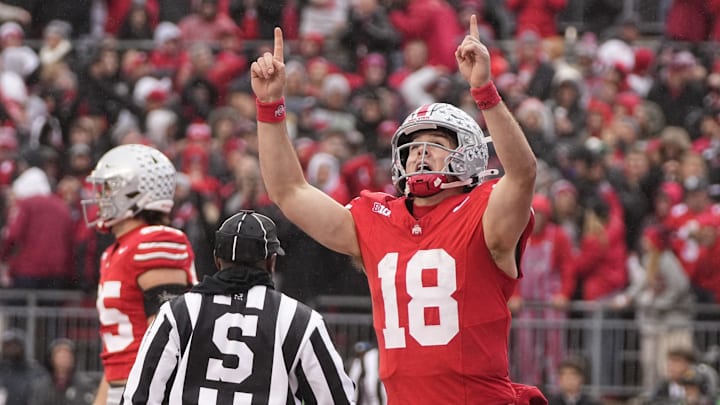 Ohio State Buckeyes quarterback Will Howard (18) celebrates a touchdown during the first half of the NCAA football game against the Indiana Hoosiers at Ohio Stadium in Columbus on Saturday, Nov. 23, 2024.