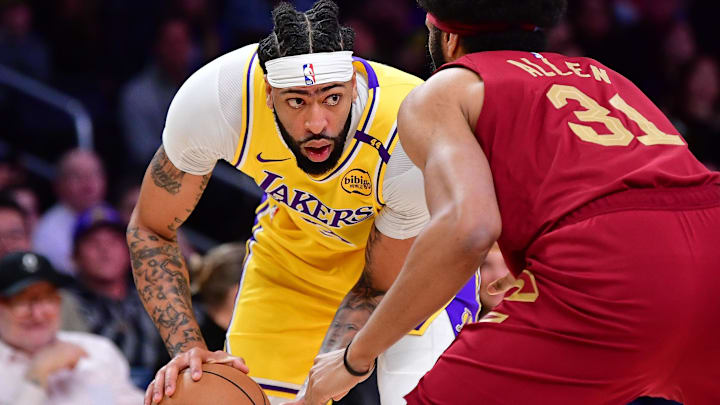 Dec 31, 2024; Los Angeles, California, USA; Los Angeles Lakers forward Anthony Davis (3) controls the ball against Cleveland Cavaliers center Jarrett Allen (31) during the first half at Crypto.com Arena. Mandatory Credit: Gary A. Vasquez-Imagn Images Dec 31, 2024; Los Angeles, California, USA; Los Angeles Lakers forward Anthony Davis (3) controls the ball against Cleveland Cavaliers center Jarrett Allen (31) during the first half at Crypto.com Arena. Mandatory Credit: Gary A. Vasquez-Imagn Images