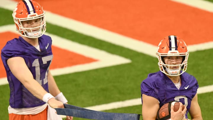 Clemson quarterback Cade Klubnik (2) in a drill with quarterback Christopher Vizzina (17)
