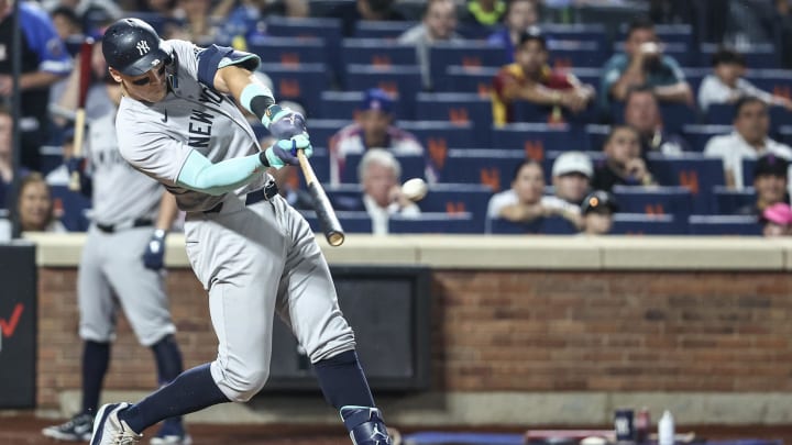 Jun 26, 2024; New York City, New York, USA;  New York Yankees center fielder Aaron Judge (99) hits a two run home run in the sixth inning against the New York Mets at Citi Field. 