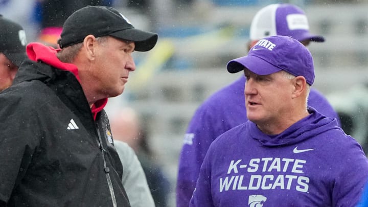Oct 25, 2025; Lawrence, Kansas, USA; Kansas Jayhawks head coach Lance Leipold, left, talks with Kansas State Wildcats head coach Chris Klieman prior to a game at David Booth Kansas Memorial Stadium. Mandatory Credit: Denny Medley-Imagn Images Oct 25, 2025; Lawrence, Kansas, USA; Kansas Jayhawks head coach Lance Leipold, left, talks with Kansas State Wildcats head coach Chris Klieman prior to a game at David Booth Kansas Memorial Stadium. Mandatory Credit: Denny Medley-Imagn Images