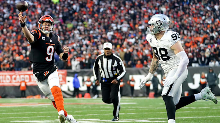Cincinnati Bengals quarterback Joe Burrow (9) throws as Las Vegas Raiders defensive end Maxx Crosby (98) pressures in the second quarter during an NFL AFC wild-card playoff game, Saturday, Jan. 15, 2022, at Paul Brown Stadium in Cincinnati.
Las Vegas Raiders At Cincinnati Bengals Jan 15 Afc Wild Card Game Cincinnati Bengals quarterback Joe Burrow (9) throws as Las Vegas Raiders defensive end Maxx Crosby (98) pressures in the second quarter during an NFL AFC wild-card playoff game, Saturday, Jan. 15, 2022, at Paul Brown Stadium in Cincinnati.
Las Vegas Raiders At Cincinnati Bengals Jan 15 Afc Wild Card Game