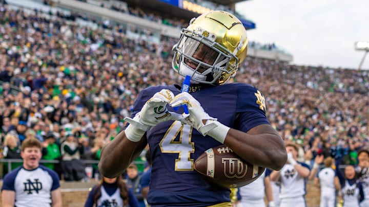 Notre Dame Fighting Irish running back Jeremiyah Love (4) celebrates a touchdown against the Syracuse Orange at Notre Dame Stadium. 