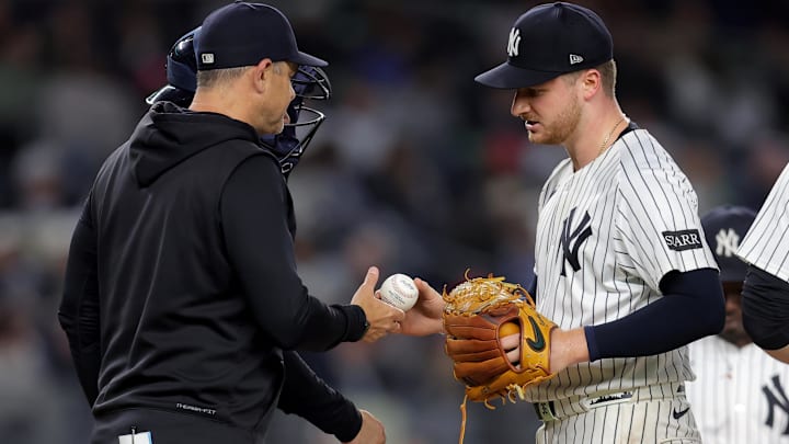 Jun 16, 2025; Bronx, New York, USA; New York Yankees starting pitcher Clarke Schmidt (36) is taken out of the game by manager Aaron Boone (17) during the eighth inning against the Los Angeles Angels at Yankee Stadium. 