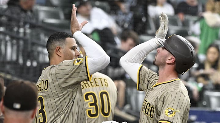 Sep 20, 2025; Chicago, Illinois, USA; San Diego Padres outfielder Jackson Merrill (3) high fives third baseman Manny Machado (13) , left, after his home run during the second inning against the Chicago White Sox at Rate Field. Mandatory Credit: Matt Marton-Imagn Images Sep 20, 2025; Chicago, Illinois, USA; San Diego Padres outfielder Jackson Merrill (3) high fives third baseman Manny Machado (13) , left, after his home run during the second inning against the Chicago White Sox at Rate Field. Mandatory Credit: Matt Marton-Imagn Images
